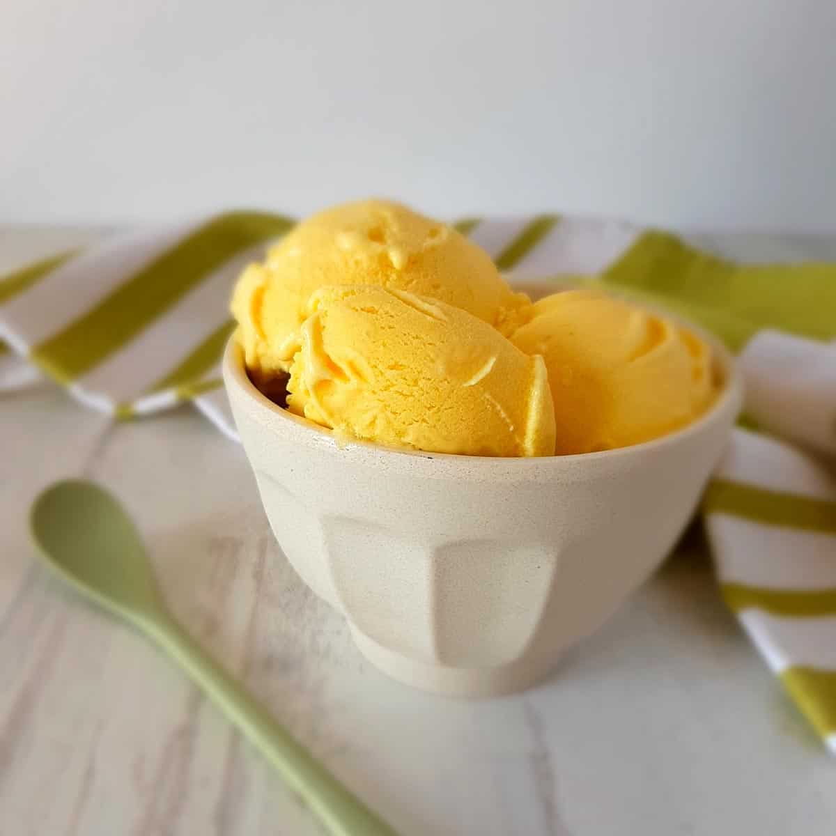 Mango Ice Cream in a bowl on a table